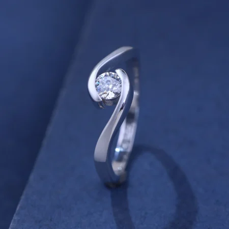 The Alencia Urban Serenade Swirl Bypass Solitaire Ring